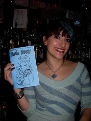 Bartender at Double Down bar, NYC. Posing with Psycho Bunny comic issue 3. Taken Dec. 2008 by Michele Witchipoo. 